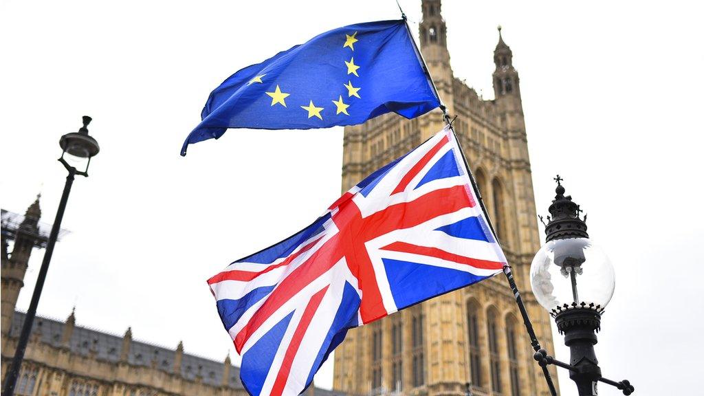 eu and uk flags outside parliament