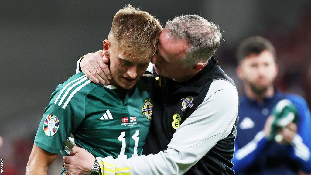 Callum Marshall is consoled by Michael O'Neill after the defeat by Denmark on his NI debut