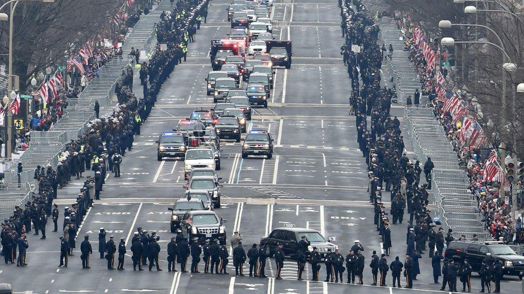 The motorcade carrying US President Barack Obama and President-elect Donald Trump rolls up Pennsylvania Avenue to the US Capitol for the swearing-in ceremony