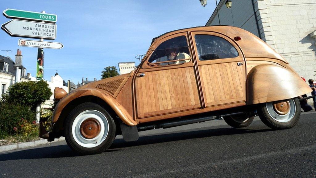 A Citroen 2 CV made out of fruitwood