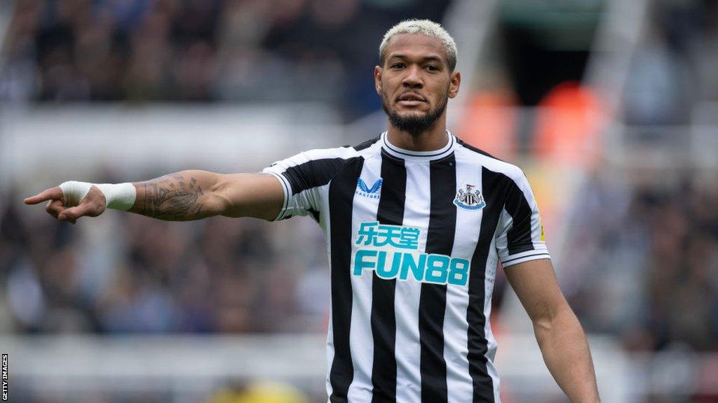 Newcastle's Joelinton gestures during a match