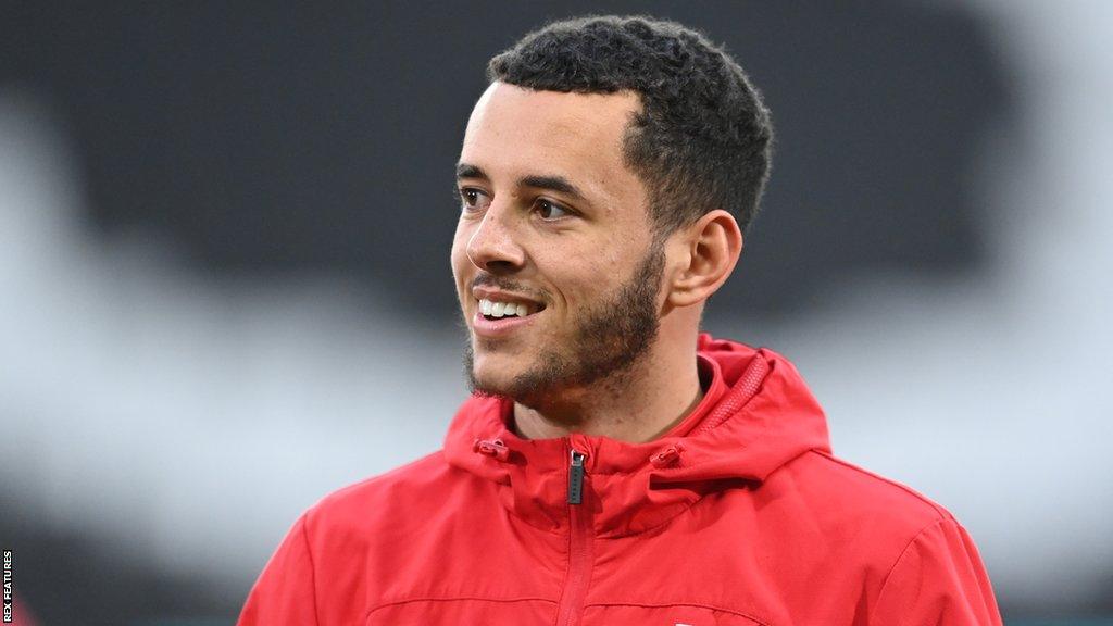 Nathan Holland during warm-up before a League One match for MK Dons last season