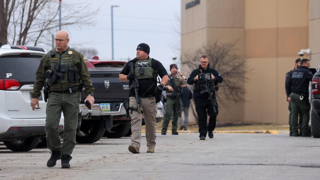 Armed police at the scene of a shooting at Perry High School in Perry, Iowa