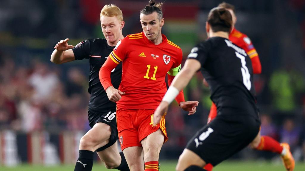 Gareth Bale of Wales is challenged by Nicolas Seiwald and Aleksandar Dragovic