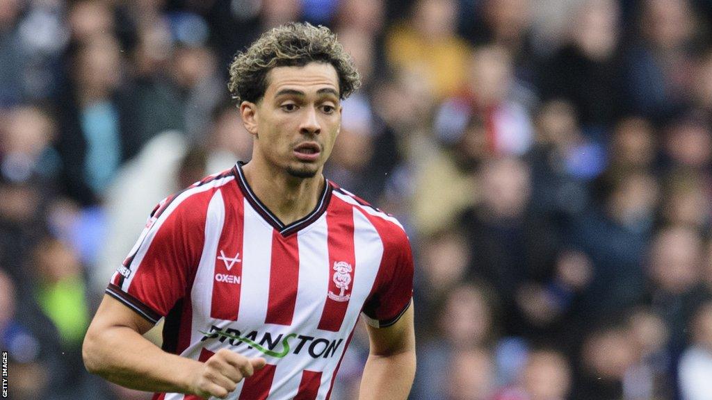 Tyler Walker in action for Lincoln City