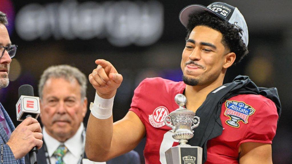 Bryce Young with the most outstanding player trophy after helping Alabama win the Sugar Bowl in December 2022