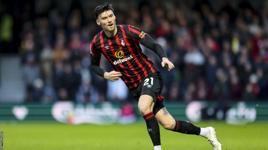 Kieffer Moore running on the pitch during a Bournemouth game