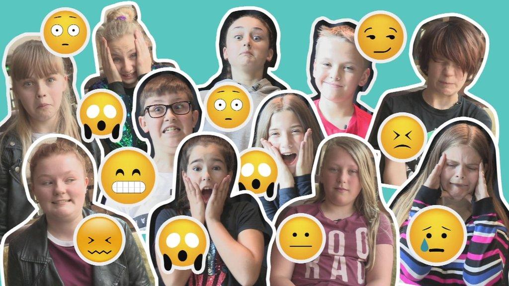 Children making emoji faces