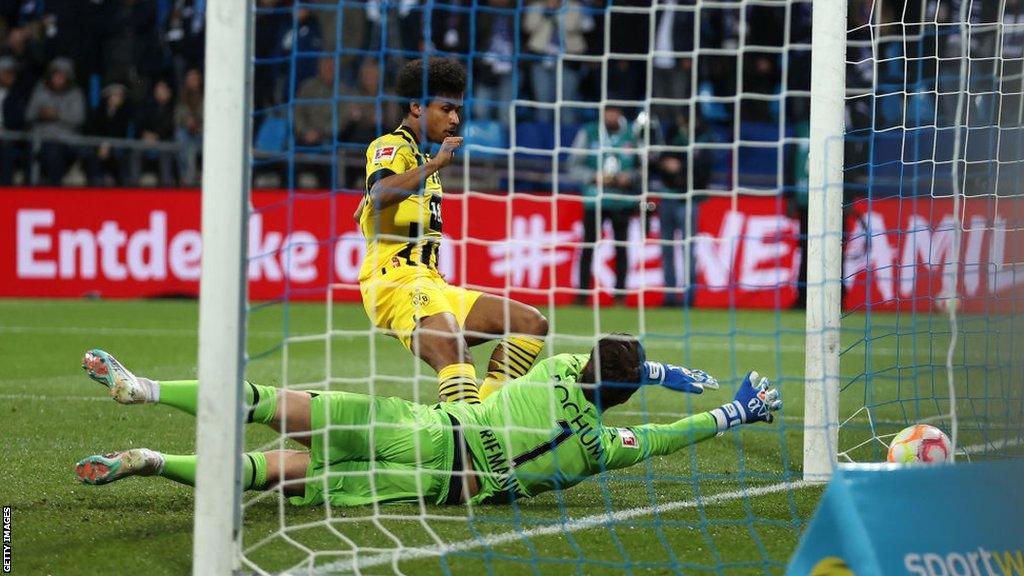 Karim Adeyemi of Borussia Dortmund scores the team's first goal at Bochum