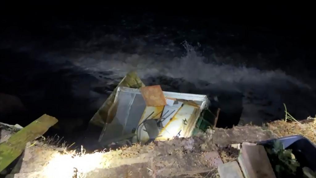 Shed falls to the beach at Hemsby in Norfolk