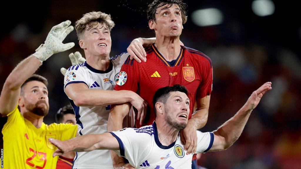 Scotland's Scott McKenna (bottom right) in action against Spain