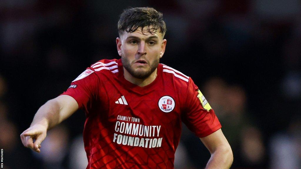 Crawley Town's Laurence Maguire was sent off for a second yellow card in the match with MK Dons