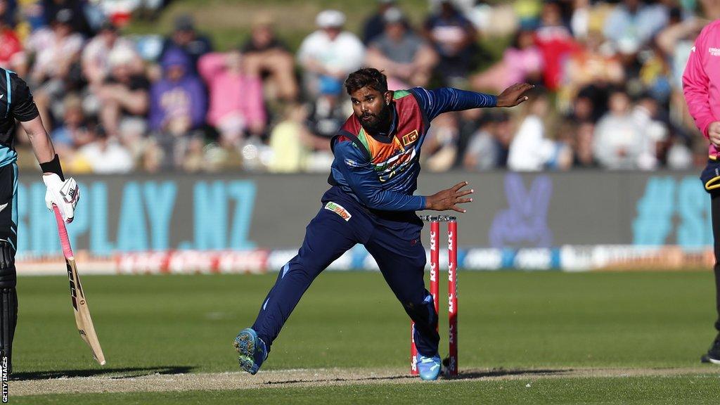 Wanindu Hasaranga bowling for Sri Lanka