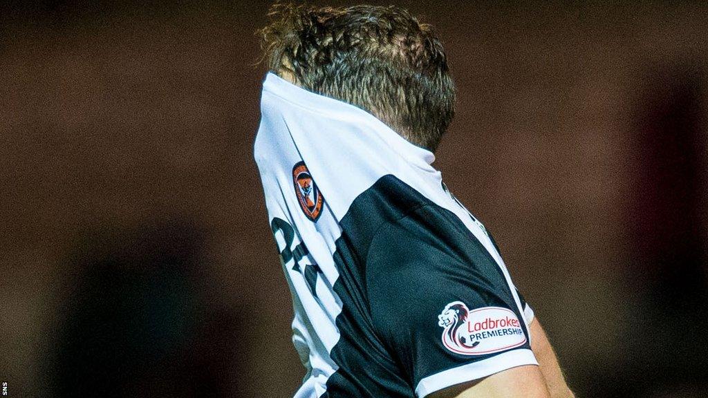 Dundee United midfielder John Rankin shows his disappointment