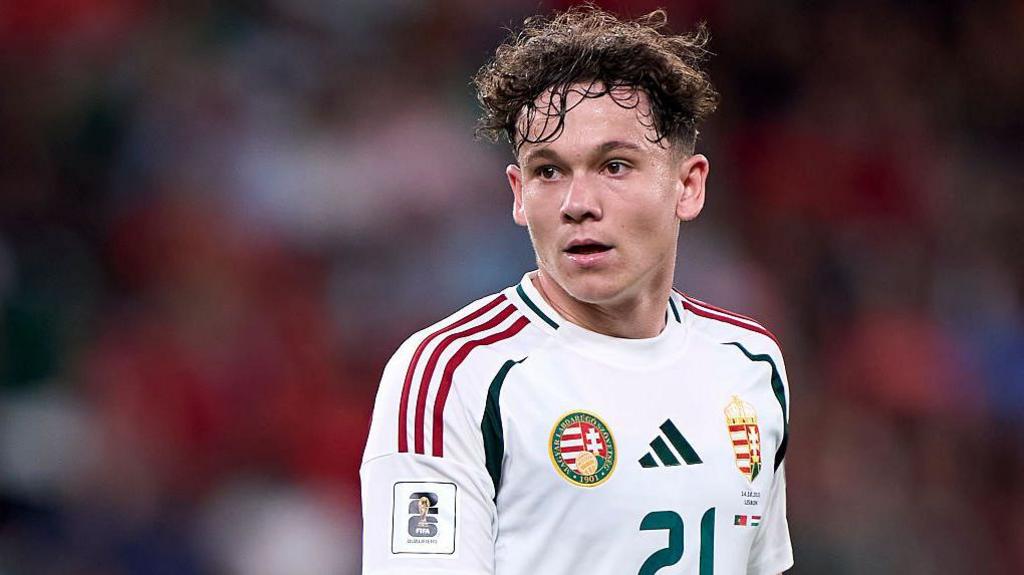 Alex Toth wearing a white Hungary national team shirt