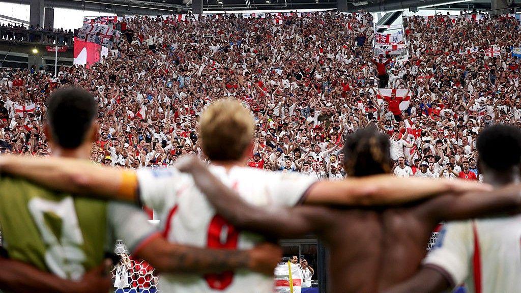 England players and fans celebrate together