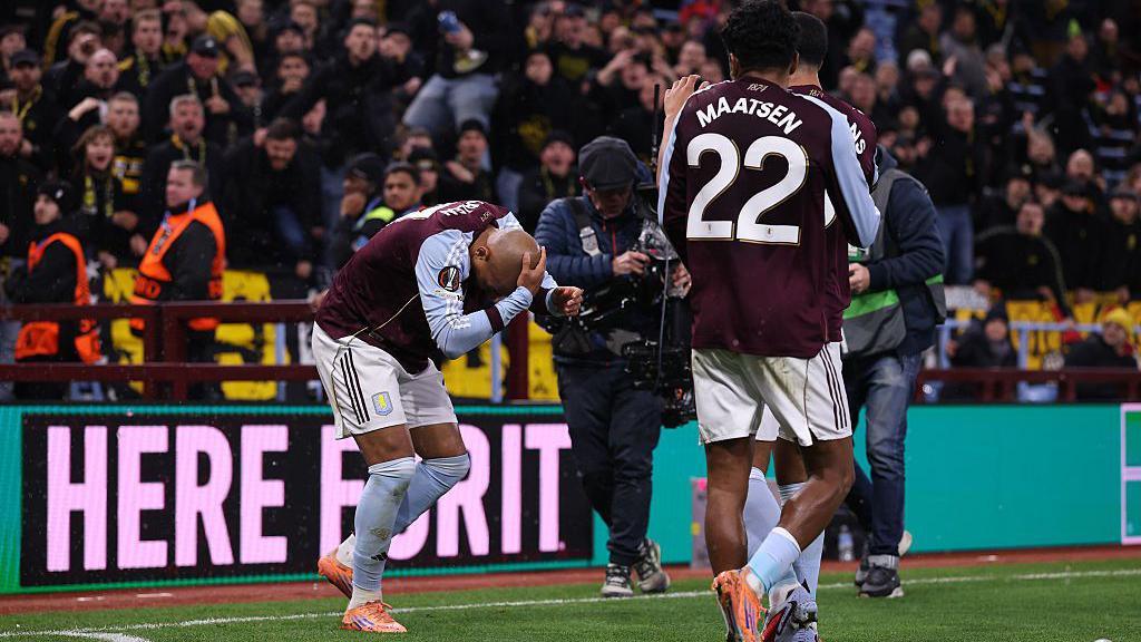 Donyell Malen of Aston Villa reacts after Young Boys fans threw items and drinks on the pitch