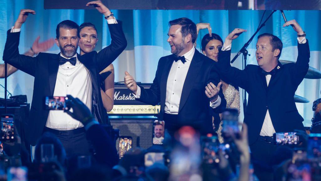 WASHINGTON, DC - JANUARY 19: (L-R) Donald Trump Jr., Bettina Anderson, U.S. Vice President-elect JD Vance, and Sergio Gor dance on stage as The Village People perform YMCA during the Turning Point USA Inaugural-Eve Ball at the Salamander Hotel on January 19, 2025 in Washington, DC. Donald Trump will be sworn in as the 47th U.S. president on January 20.