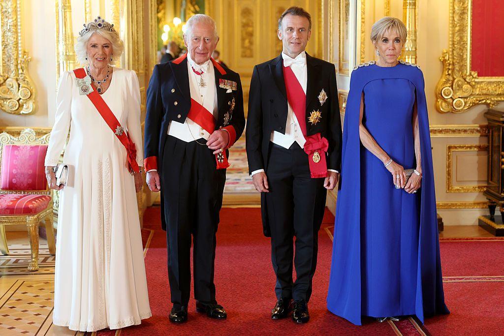 Queen Camilla, Emmanuel Macron, King Charles and Brigitte Macron stand in a line as they post for a photo at the state banquet