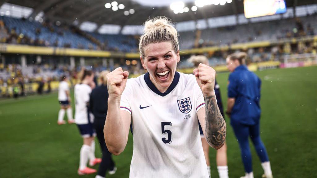 Millie Bright celebrates after England's match with Sweden