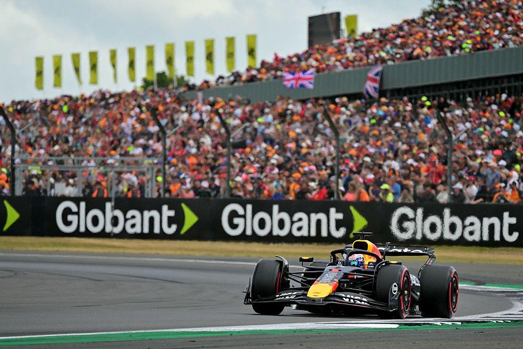 Max Verstappen with Silverstone grandstands in the background