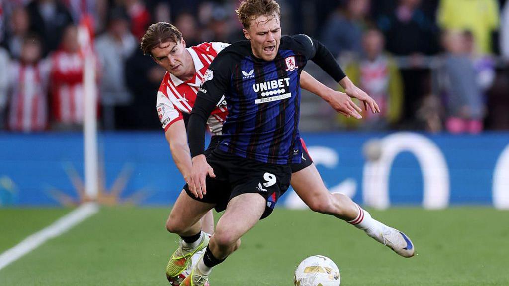 James Bree of Southampton tackles Tommy Conway of Middlesbrough