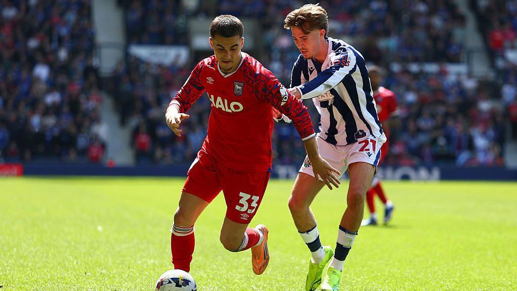 Anis Mehmeti of Ipswich Town and Isaac Price of West Bromwich Albion in action during the Sky Bet Championship match between West Bromwich Albion and Ipswich Town at The Hawthorns.