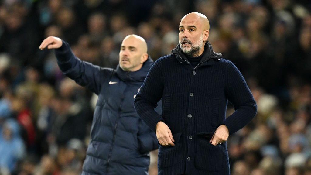 Pep Guardiola with Enzo Maresca in background 