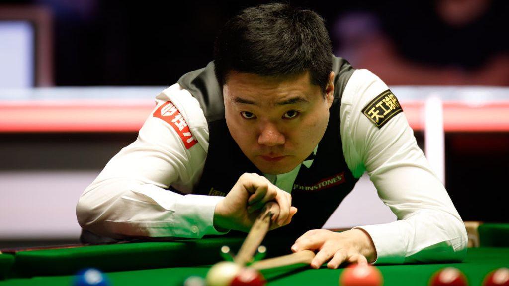 Ding Junhui of China plays a shot