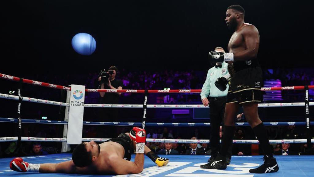 Hussein Muhamed on the canvas after being knocked down by Lawrence Okolie