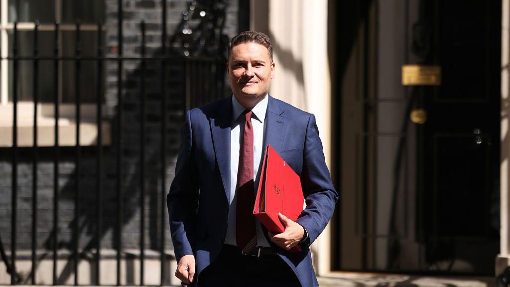 A man in a suit.
