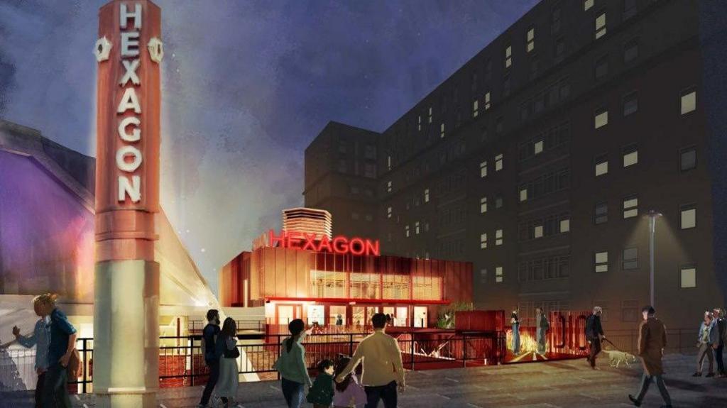 A computer-generated image showing what The Hexagon theatre in Reading would look like at night. It's a modern-looking rectangular building lit up in red, with a tall pillar next to it saying "Hexagon" on it.