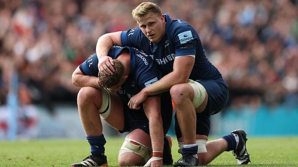 Sale Sharks player Dan du Preez comforts brother Jean-Luc after the team's play-off defeat at Leicester Tigers in May 2025.