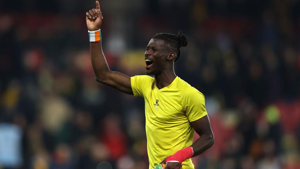 Vakoun Bayo celebrates with the Watford support after the final whistle against Oxford United in the Championship