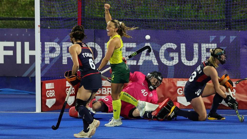 Ambrosia Malone celebrates scoring against Great Britain