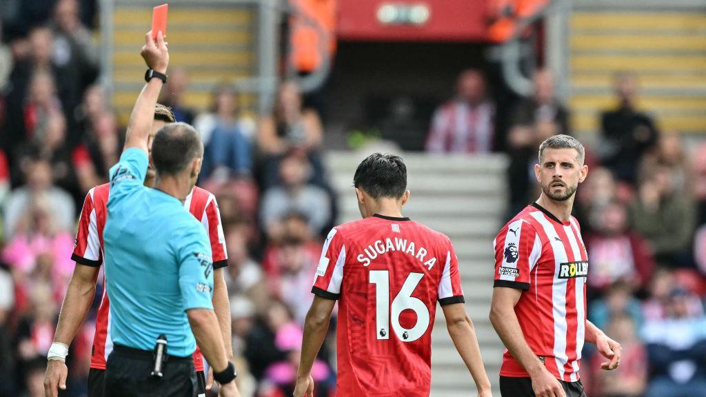 Southampton's Jack Stephens (R) reacts as he receives a red card against Manchester United