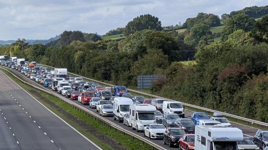 M5 taken from bridge above with line of traffic to the right