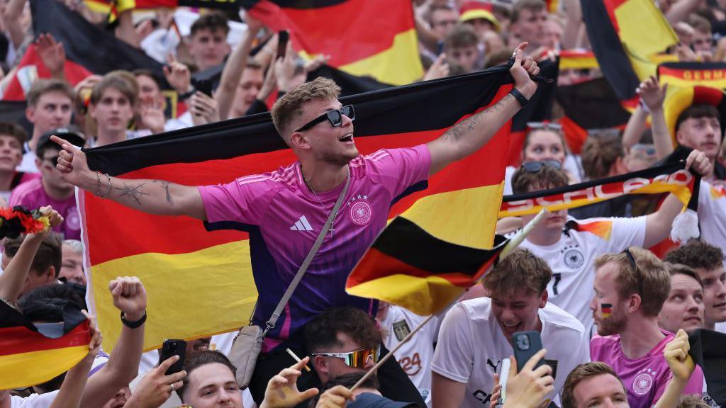 Germany fans cheer on their team in a fan zone