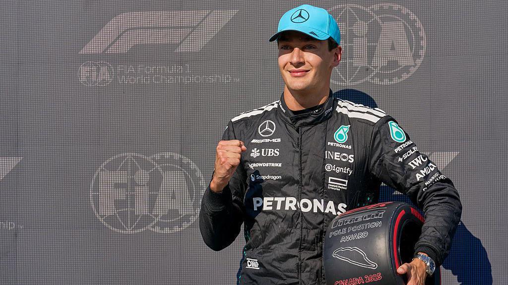 George Russell holds his Pirelli Pole Position Award in Montreal 