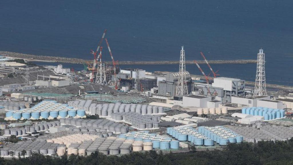 This aerial picture shows storage tanks used for storing treated water at TEPCO's crippled Fukushima Daiichi Nuclear Power Plant
