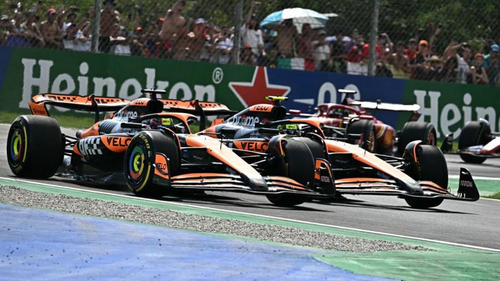 Oscar Piastri overtakes McLaren team-mate Lando Norris to take the lead of the Italian Grand Prix