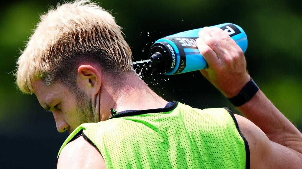 Scotland's George Hirst cools off with water during a training session at the Atrium Health Training Ground in Charlotte, North Carolina.