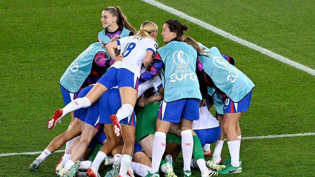 England players celebrate after winning the penalty shoot