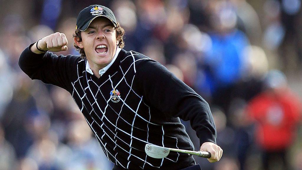 The golfer Rory McIlroy clenches his fist as he celebrates holing a putt on the Celtic Manor's Ryder Cup 2010 course.