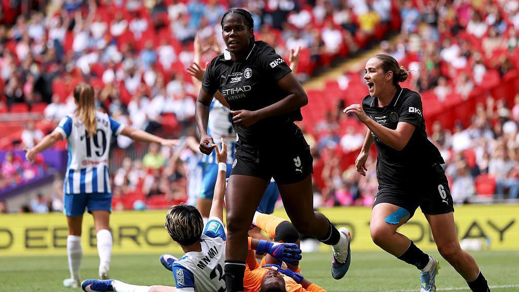 Khadija Shaw celebrates scoring for Manchester City