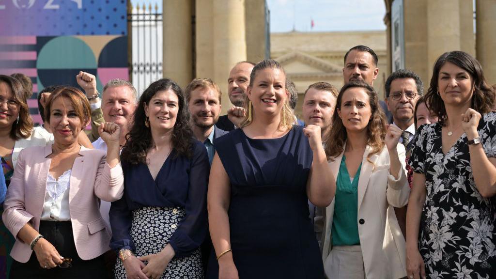 French newly-elected Members of Parliament (MPs) for La France Insoumise political party (LFI) of the leftist coalition "Nouveau Front Populaire" (New Popular Front - NFP) pose for a photo group session as they arrive to the National Assembly in Paris, on July 9, 2024