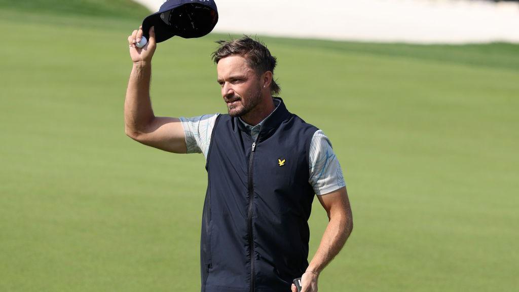 Brandon Robinson-Thompson of England acknowledges the gallery after shooting a round of 61 and setting a new course record on day one of the Bahrain Championship 2025