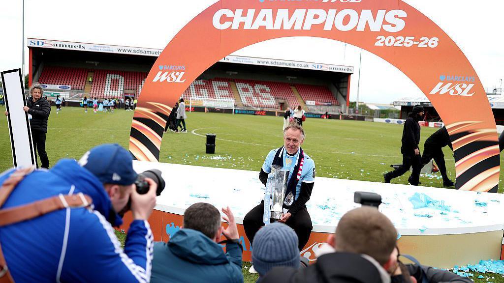 Andree Jeglertz is photographed with the WSL trophy