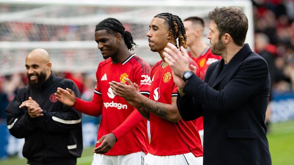 Manchester United head coach Michael Carrick (right), with Leny Yoro, Ayden Heaven and Bryan Mbeumo (left) after the 2-1 win against Crystal Palace