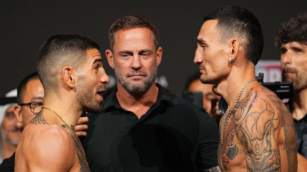 Opponents Ilia Topuria of Spain and Max Holloway face off during the UFC 308 ceremonial weigh-in at Etihad Arena